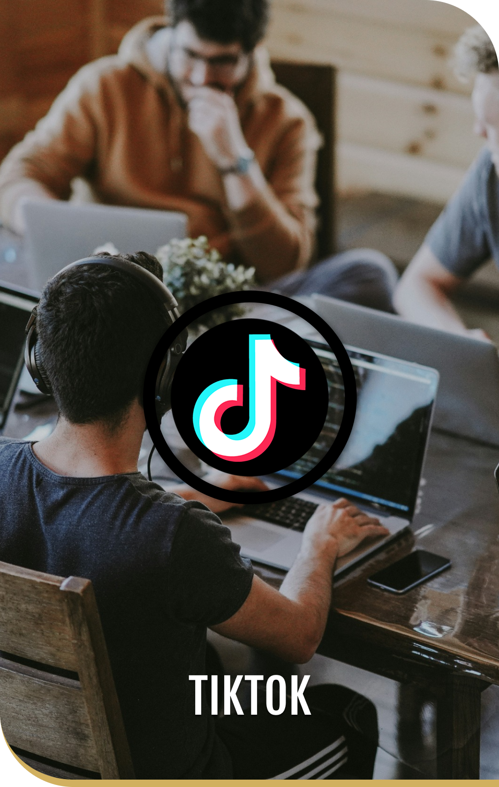 A man is using a laptop with a tiktok logo on it