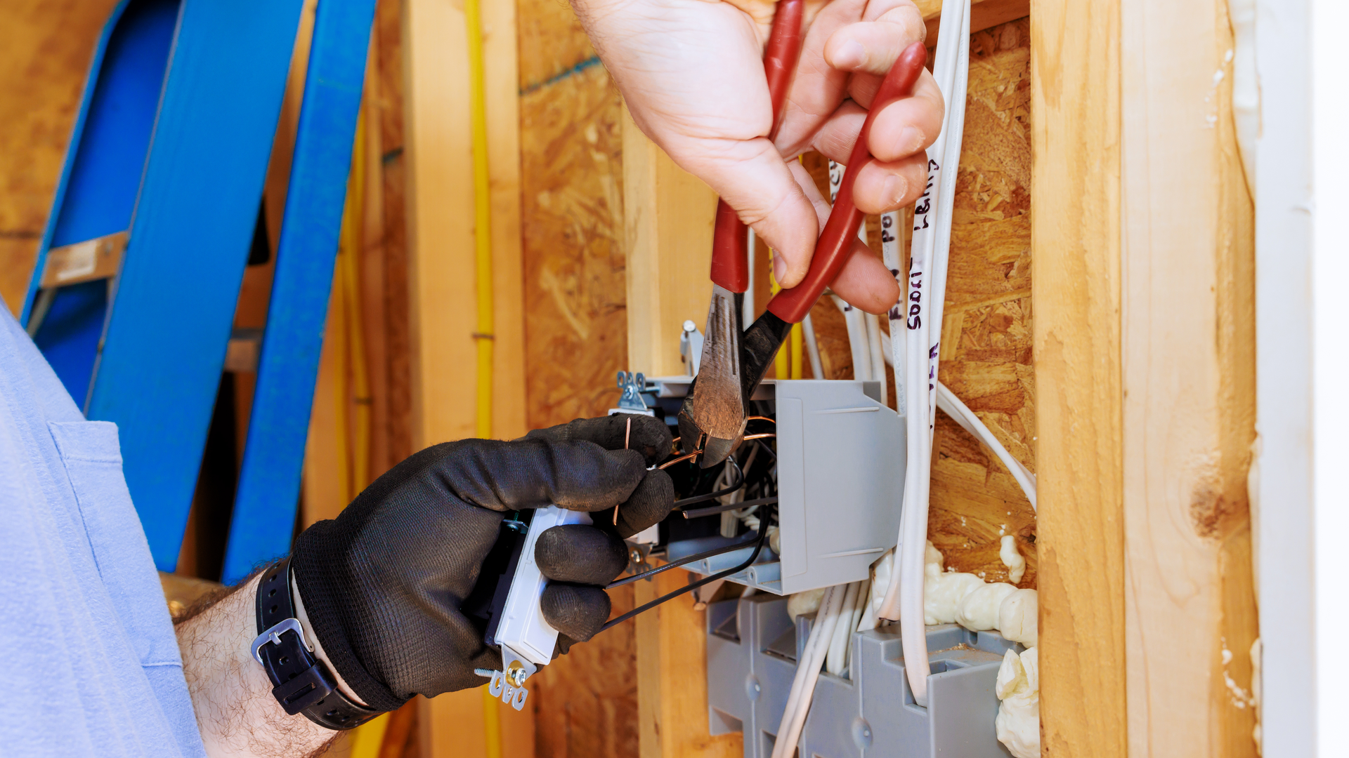 Air conditioning units with toolbox and gloves in backyard.