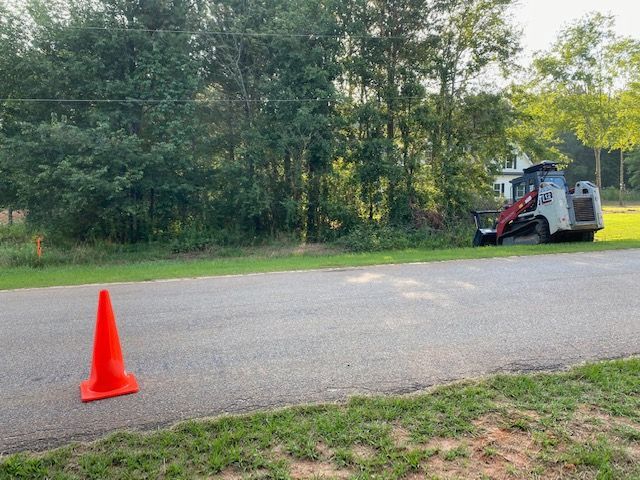 Road View With Sign— Loganville, GA — Georgia's Best Clearing & Grading
