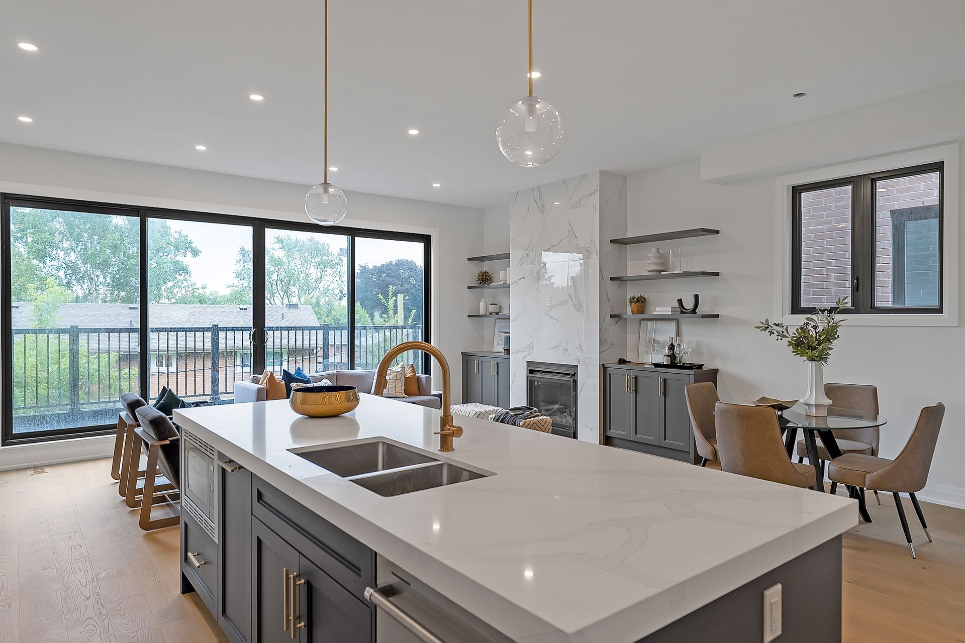 A kitchen with two sinks and a large island in the middle of the room.