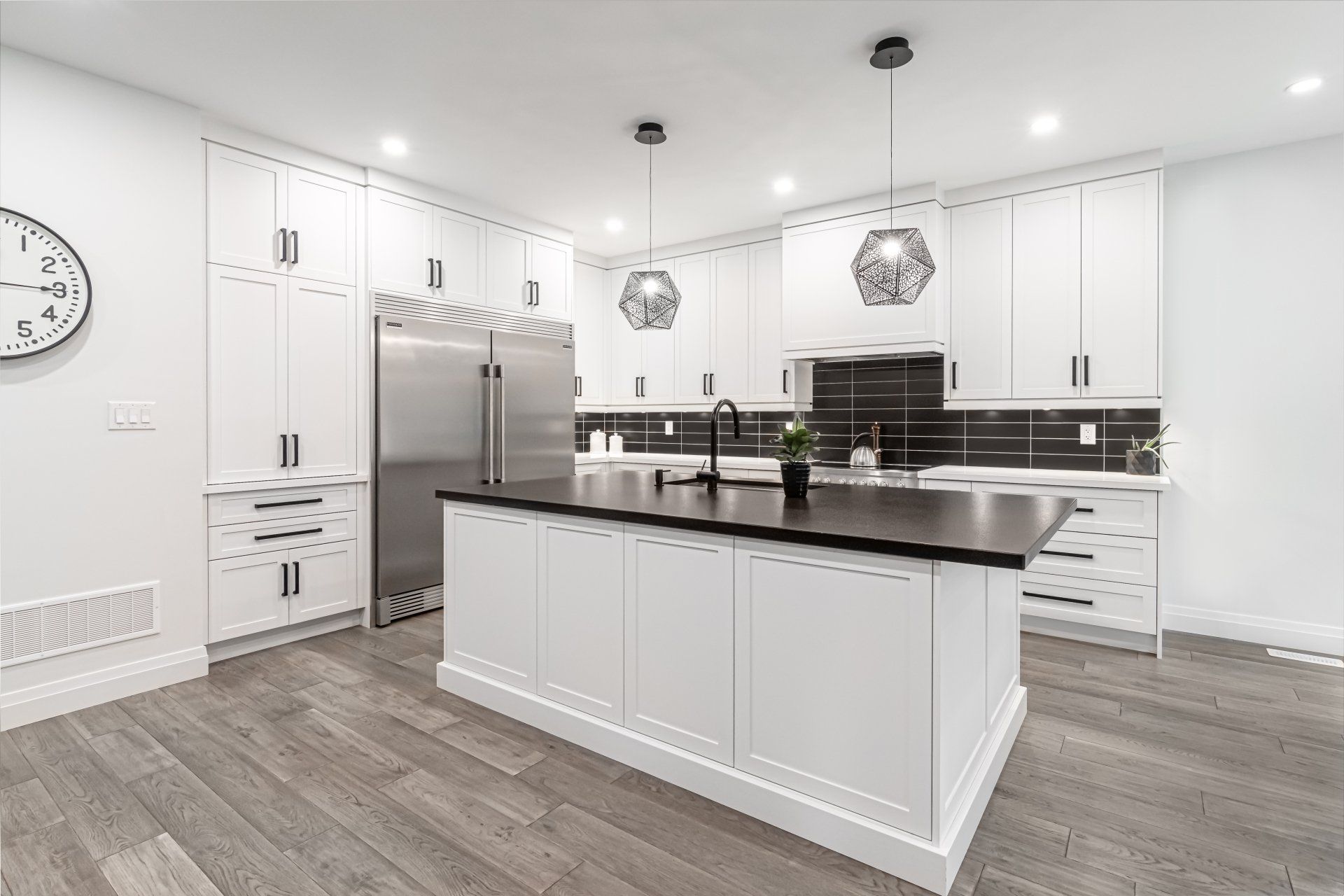 There is a large island in the middle of the kitchen.