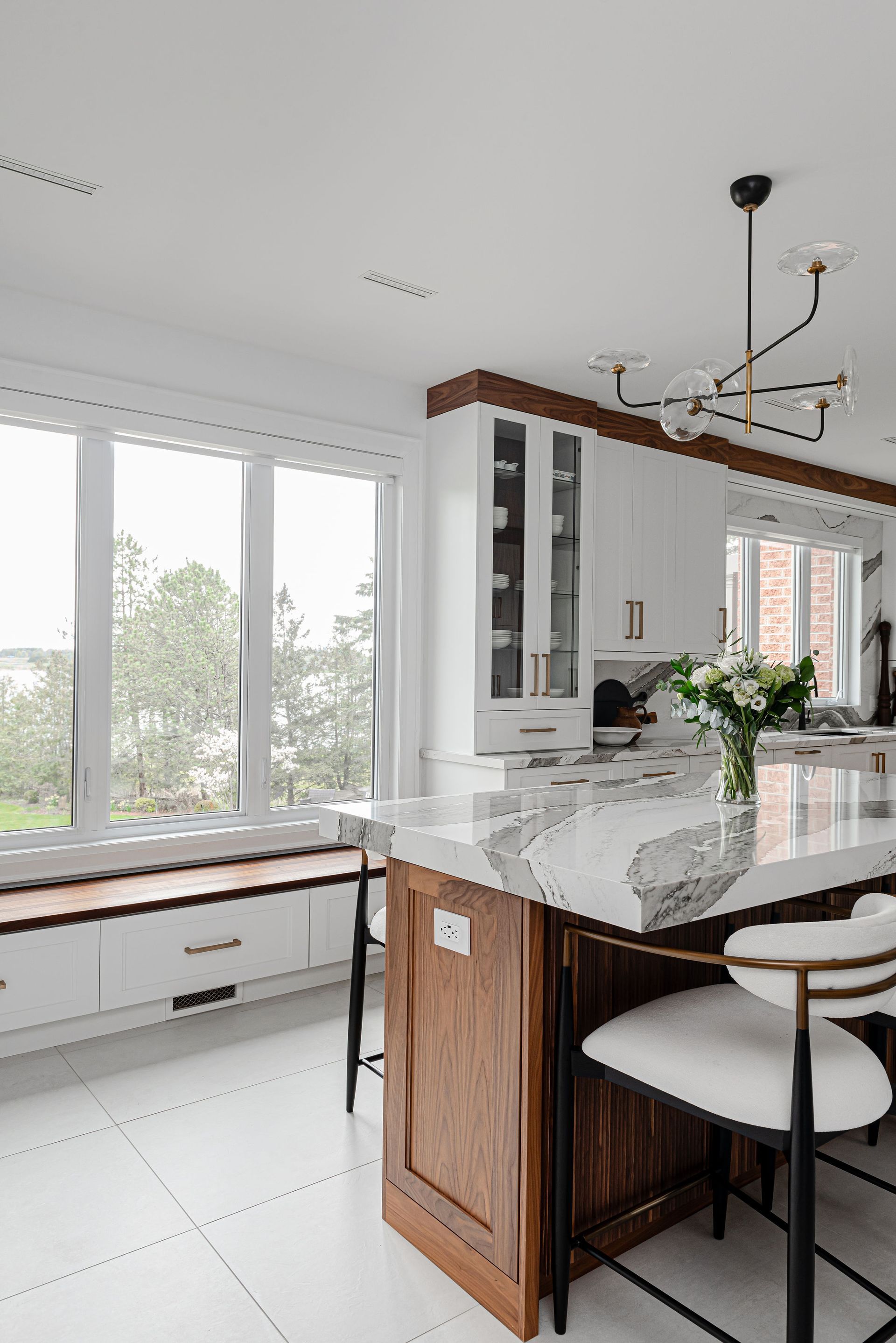 There is a large island in the middle of the kitchen.