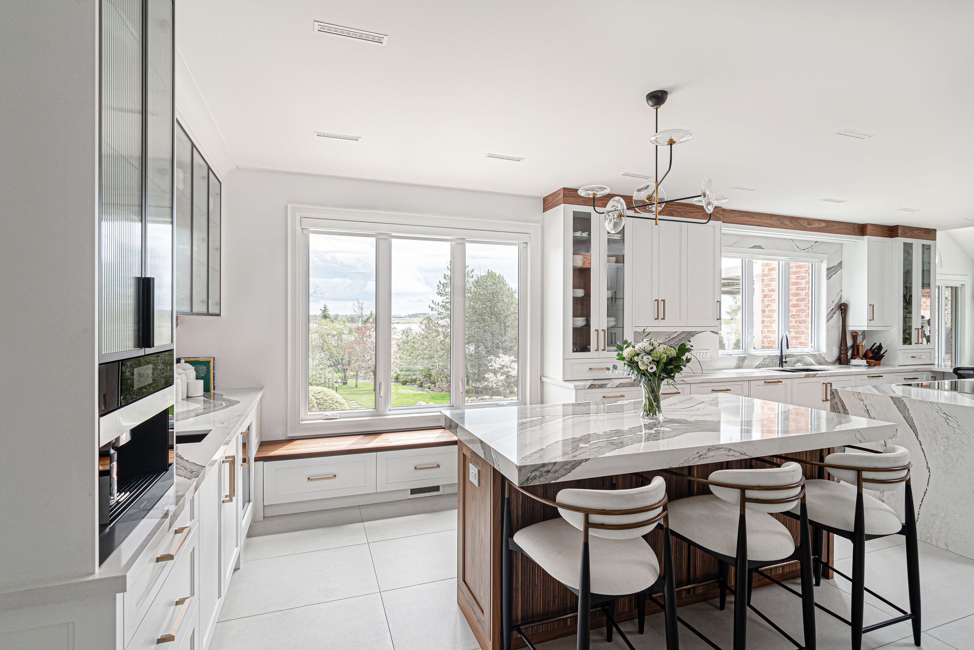 There is a large island in the middle of the kitchen.