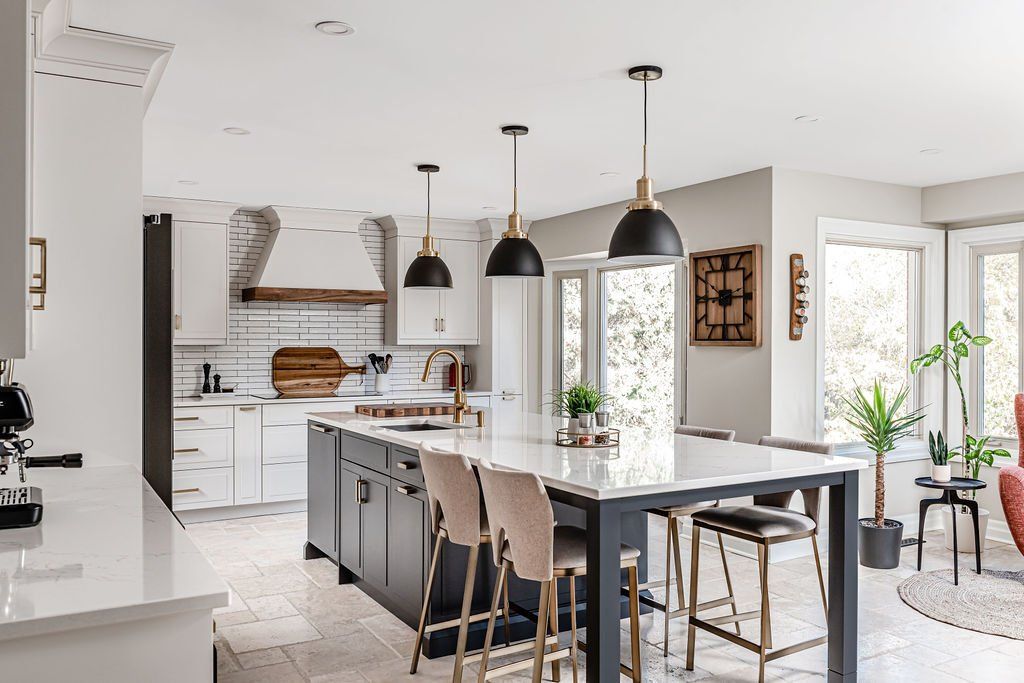 There is a large island in the middle of the kitchen.