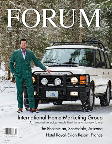 A man in a green suit is standing next to a white suv on the cover of a magazine.