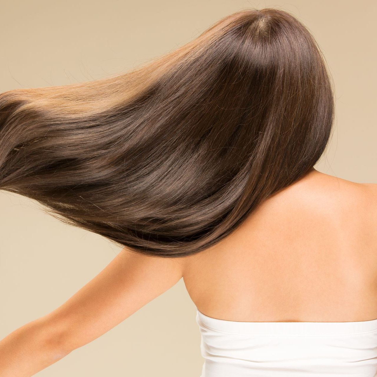 The back of a woman with long straight hair
