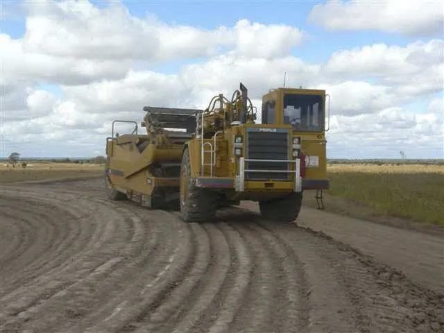 Front View Of The Excavator Equipment Land With Equipment Excavator In Front — Mike Barlow Earthmoving Pty Ltd in Rockhampton, QLD