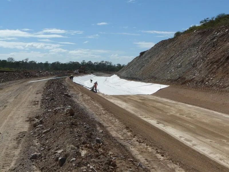 A Dirt Road with A Large Hill in The Background — Mike Barlow Earthmoving Pty Ltd in Rockhampton, QLD