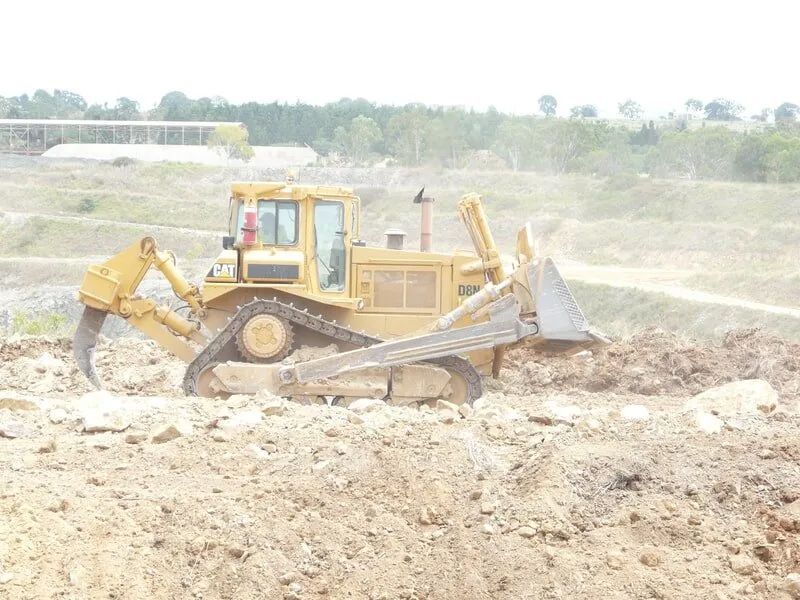 One Yellow Bulldozer In The Construction Site — Mike Barlow Earthmoving Pty Ltd in Rockhampton, QLD