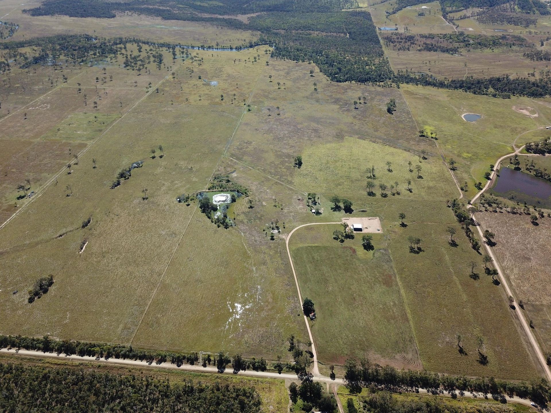 Two Bulldozers Are Working in A Muddy Field — Mike Barlow Earthmoving Pty Ltd in Rockhampton, QLD