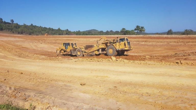 Two Yellow Big Excavators On The Site — Mike Barlow Earthmoving Pty Ltd in Rockhampton, QLD