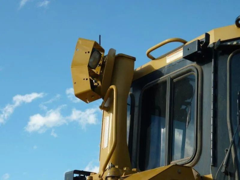 A Yellow Bulldozer With A Blue Sky In The Background — Mike Barlow Earthmoving Pty Ltd in Rockhampton, QLD