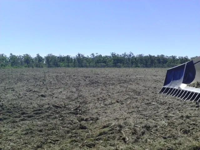 Large Land Two Yellow Big Excavator In The Dirty Field — Mike Barlow Earthmoving Pty Ltd in Rockhampton, QLD