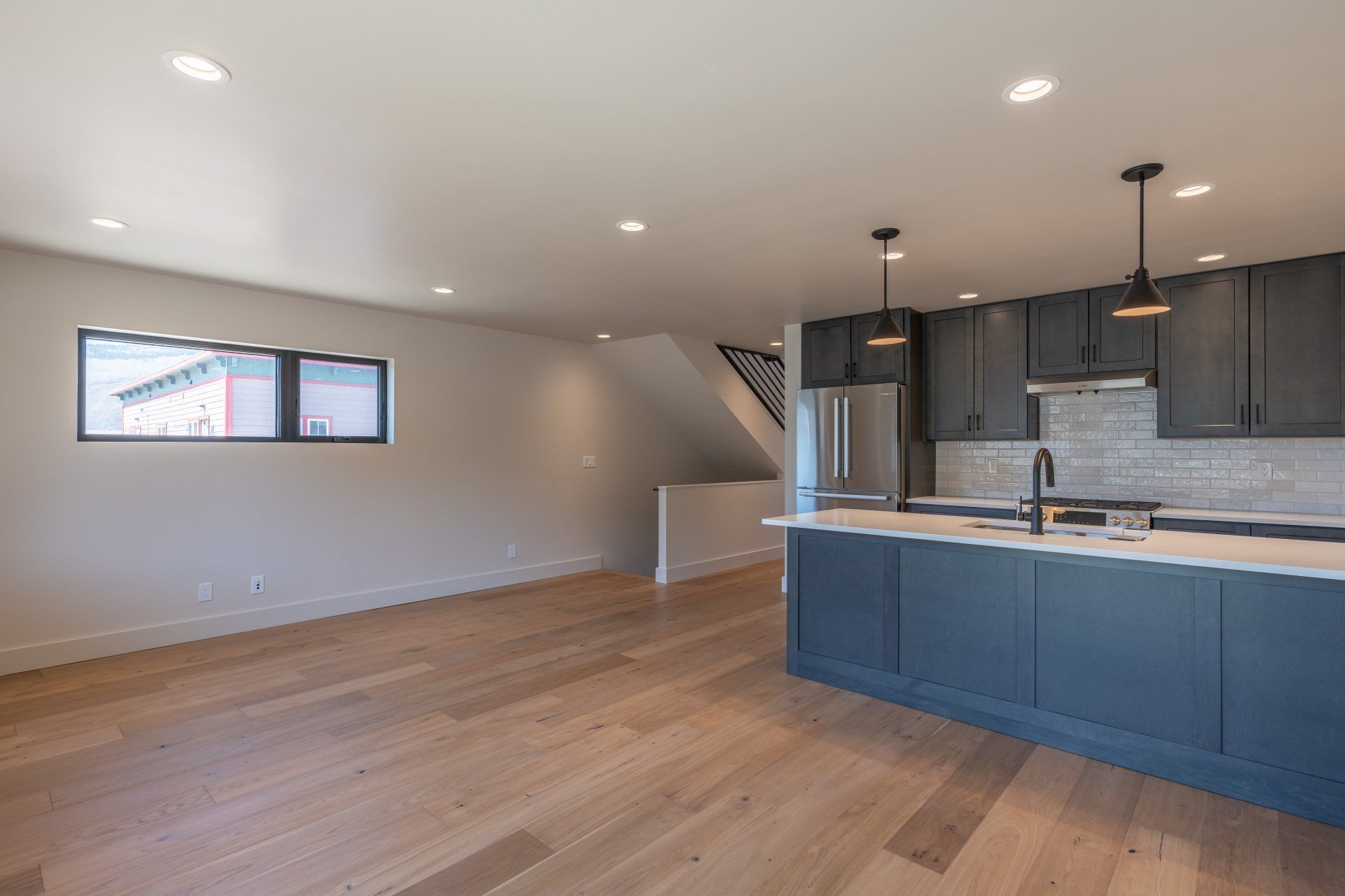 There is a kitchen in the middle of the room.