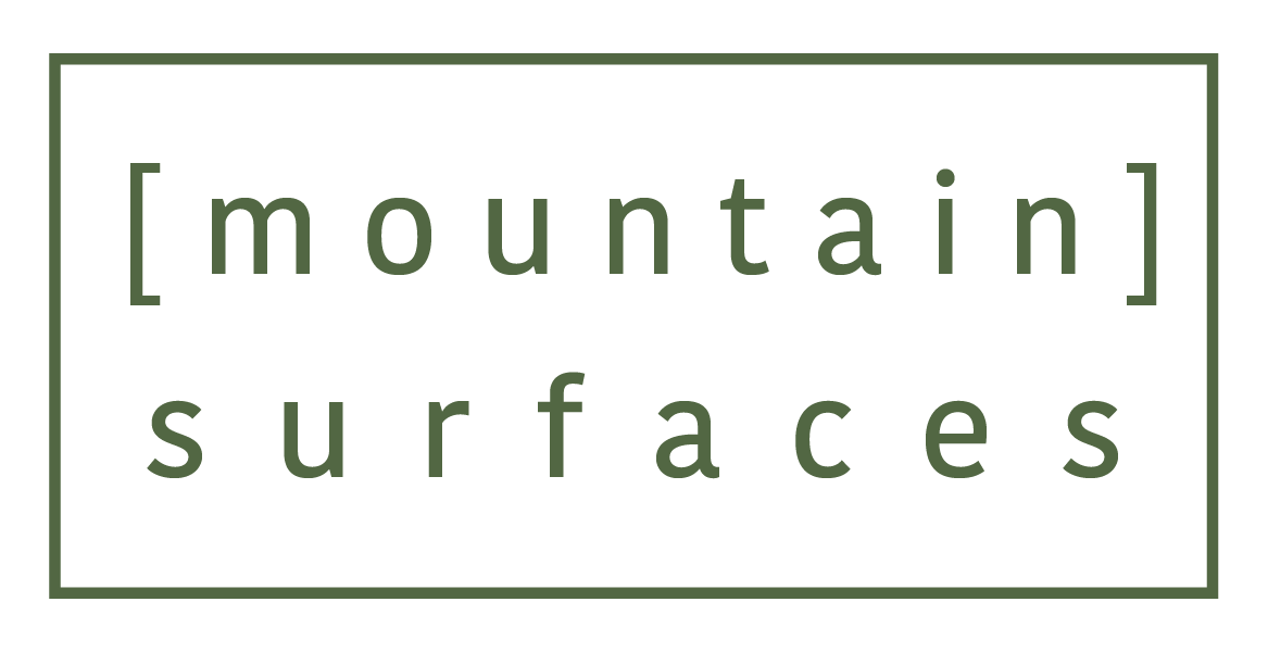 A logo for mountain surfaces is shown on a white background.