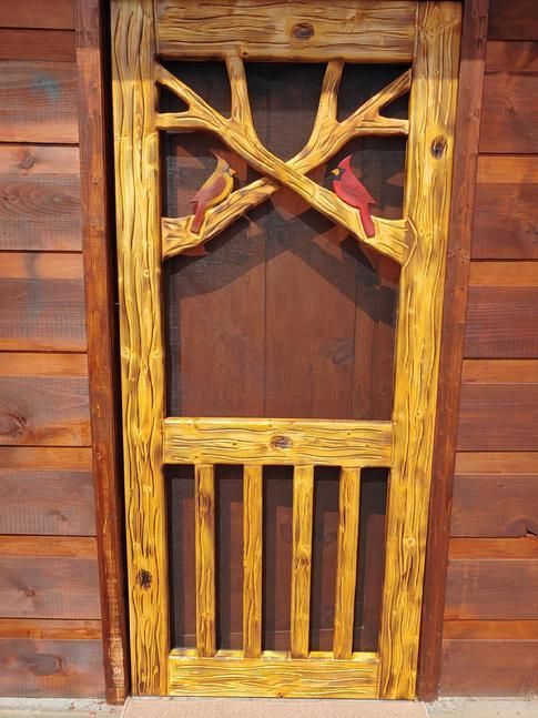 Door showing both a male and female cardinal
