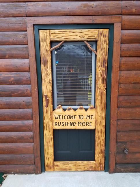 Door displays a sign saying Mt. Rush No More
