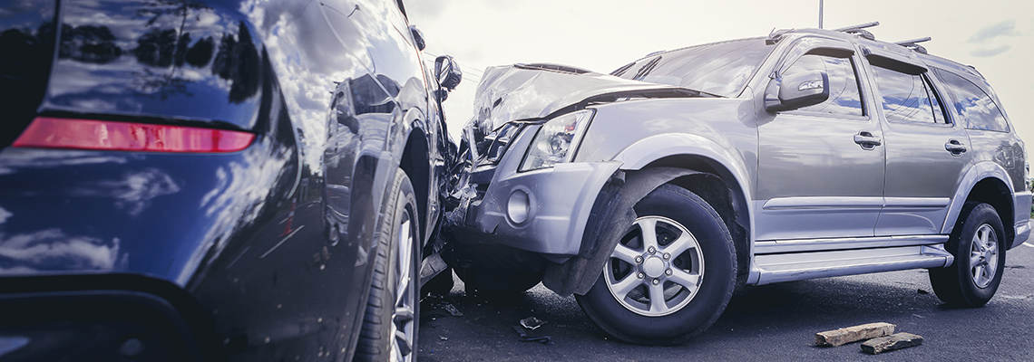 Two cars are involved in a car accident on the road. Two cars are involved in a car accident on the road.