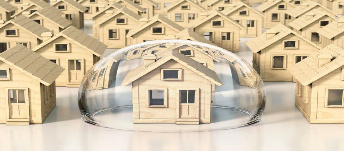 A group of wooden houses are sitting under a glass dome.