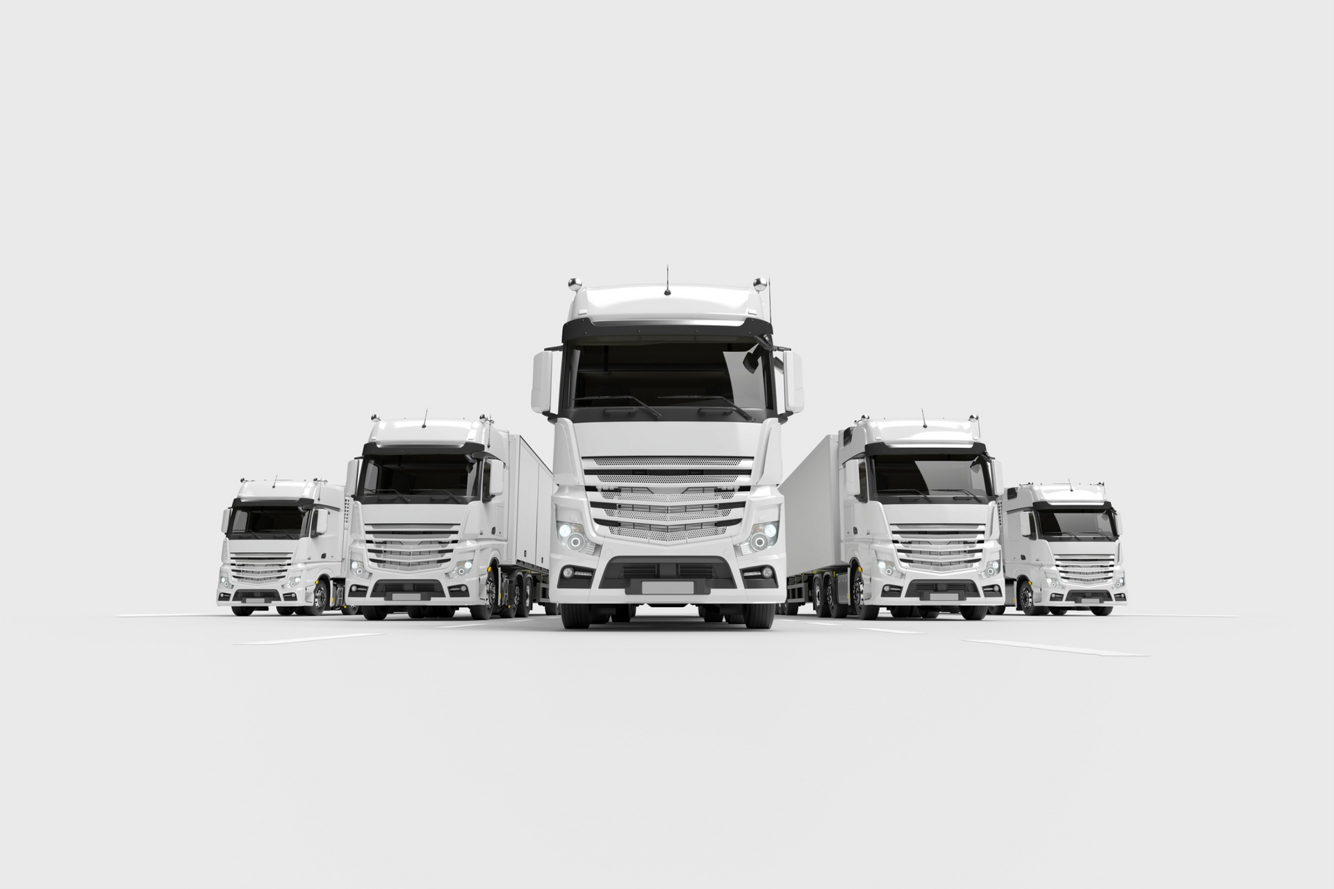 A group of white semi trucks are parked next to each other on a white background.