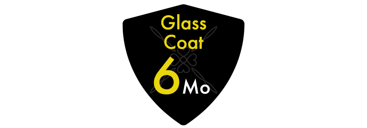 A black shield with the words `` glass coat 6 mo '' written on it.