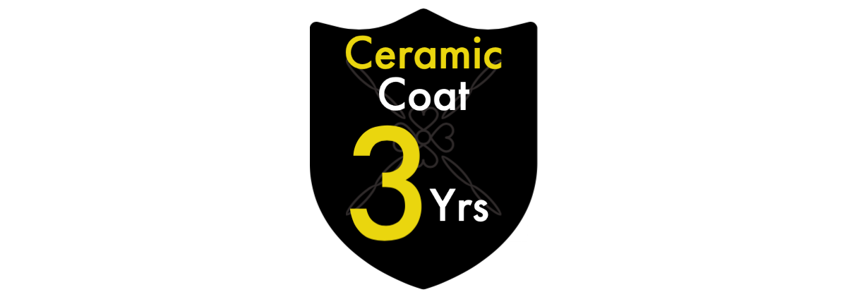 A black shield with the words `` ceramic coat 3 yrs '' on it.