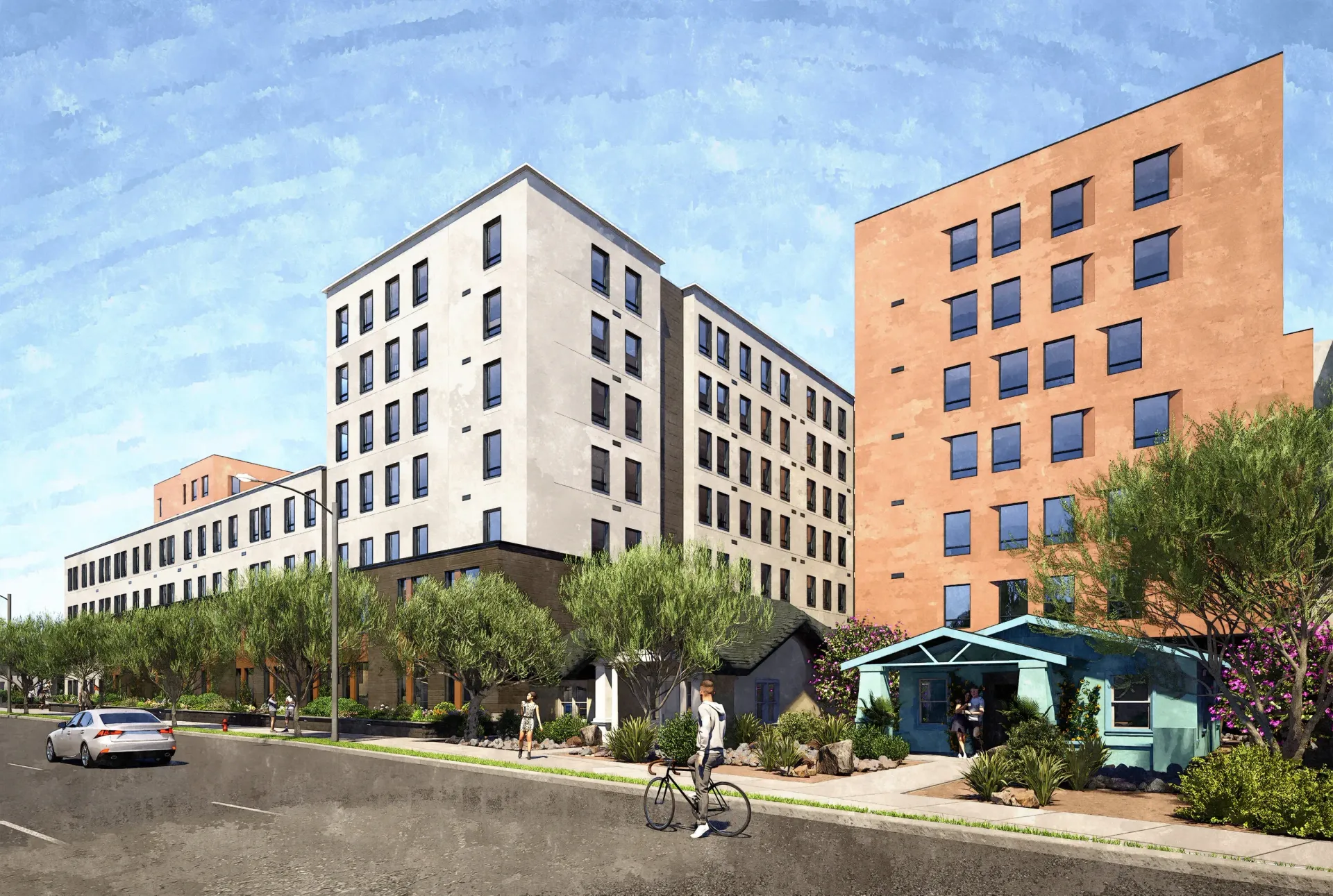 Exterior view of modern apartment buildings with landscaping and street.