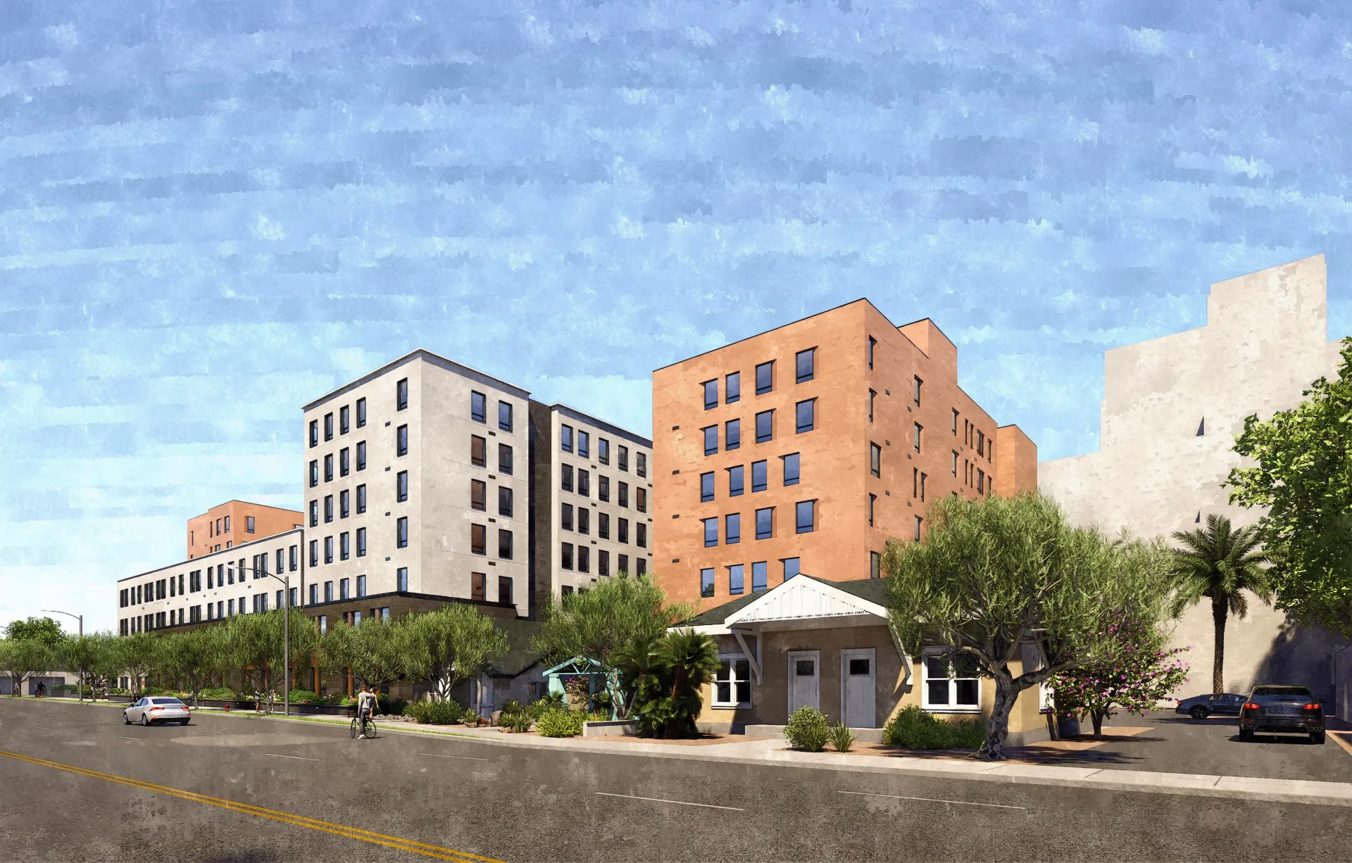 Exterior view of modern apartment buildings with landscaping and a street in the foreground.