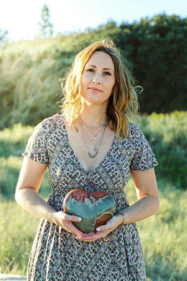 A Woman In A Dress Is Holding A Heart In Her Hands — The Enchanted Wolf Holistic Port Macquarie, NSW
