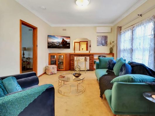 Living room with seating, smart TV and natural light at Alexandra Ave Geelong accommodation