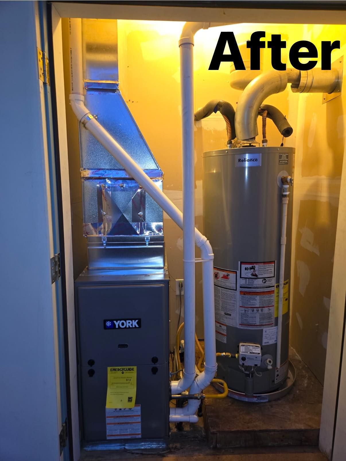 A utility closet containing a new York furnace and water heater with white PVC piping, labeled 