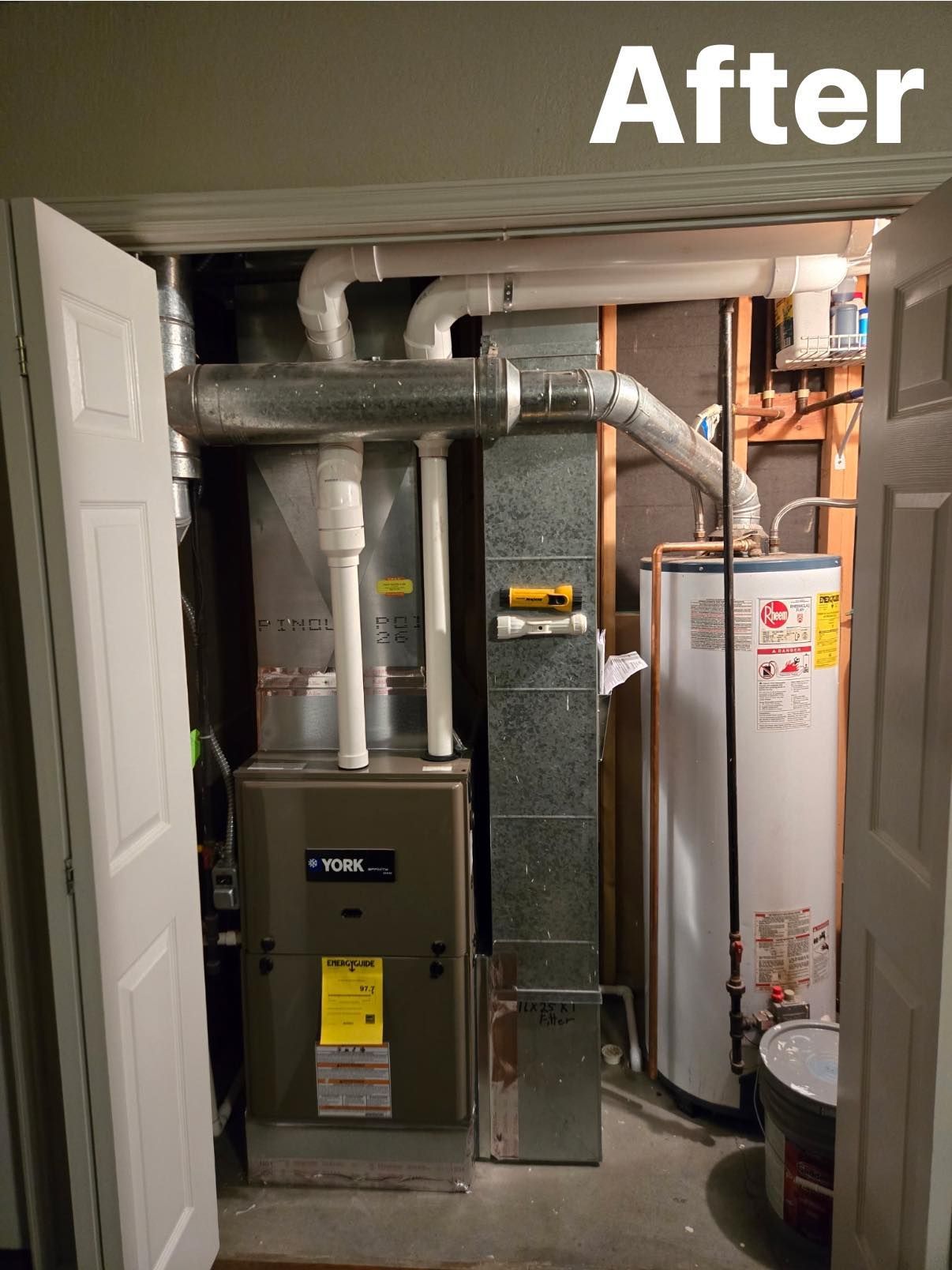 A utility closet containing a gas furnace, a metal air duct system, and a white water heater, labeled 