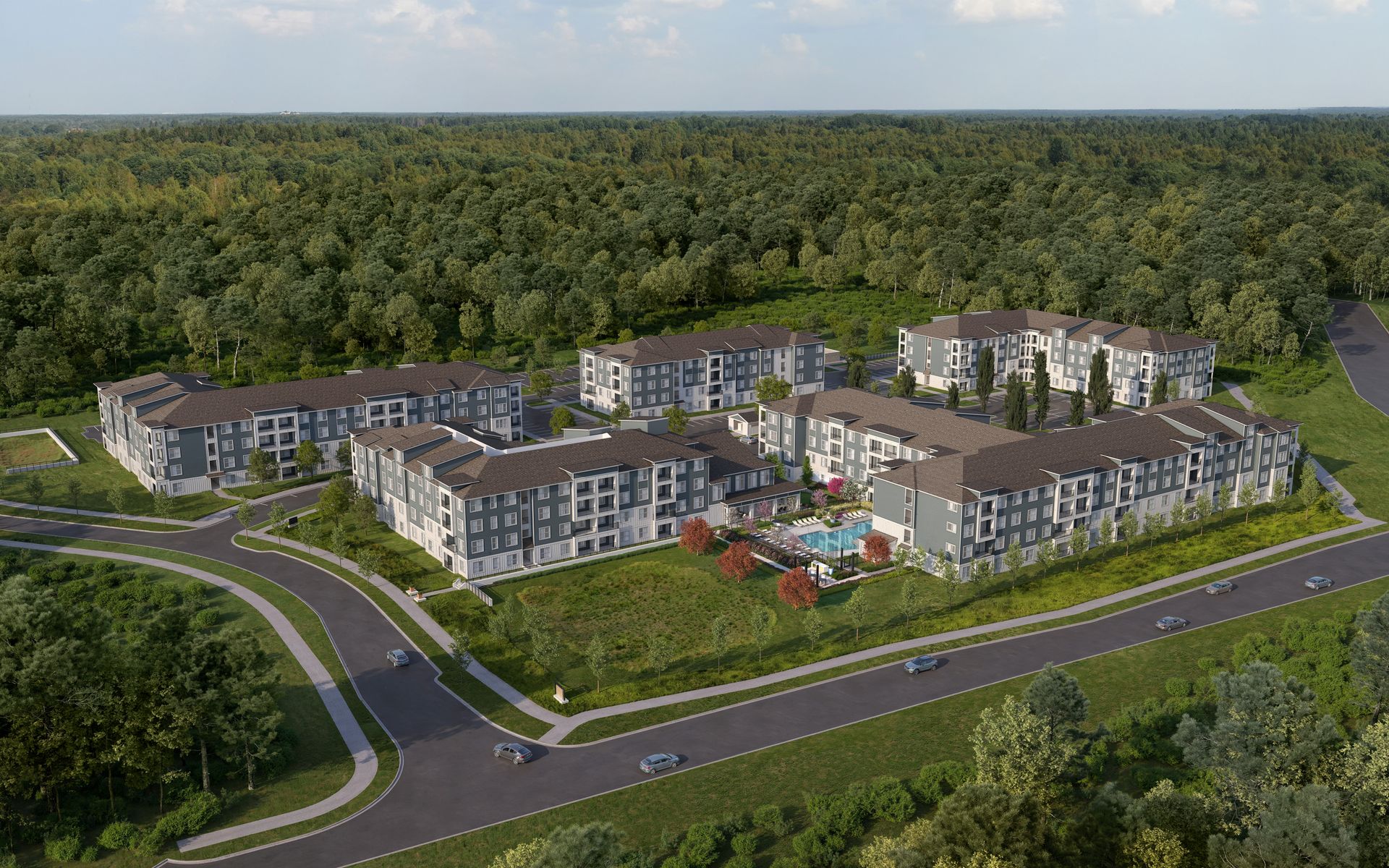 Aerial view of Mallard Creek apartment complex with pool, surrounded by trees and a road.