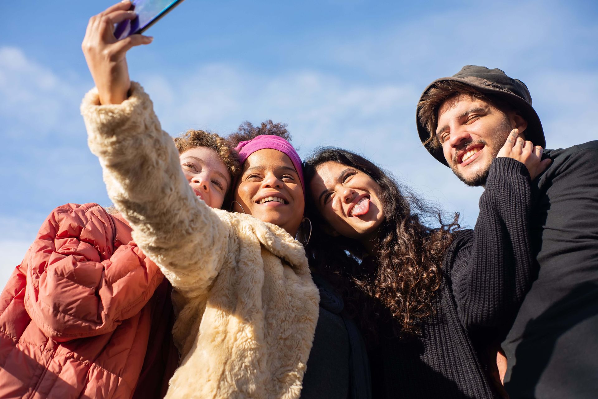 Group of friends smiling while taking a selfie, representing meaningful relationships, connection, and confidence supported through therapy for social anxiety in Omaha, NE | therapy for social anxiety omaha ne - anxiety counseling omaha ne - anxiety therapist omaha ne - elkhorn - gretna - bennington - blair - millard - wahoo - waverly - papillion