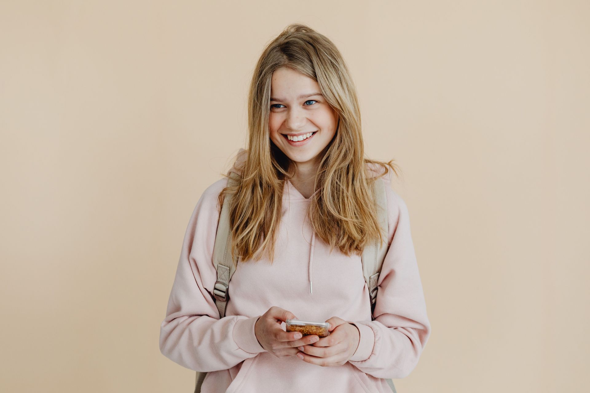 Smiling teenager at school, symbolizing confidence, connection, and improved well-being supported through anxiety and depression in Omaha, NE | anxiety in sports omaha ne - anxiety and athletes omaha ne - anxiety therapy omaha ne - elkhorn - gretna - bennington - blair - millard - wahoo - waverly - papillion