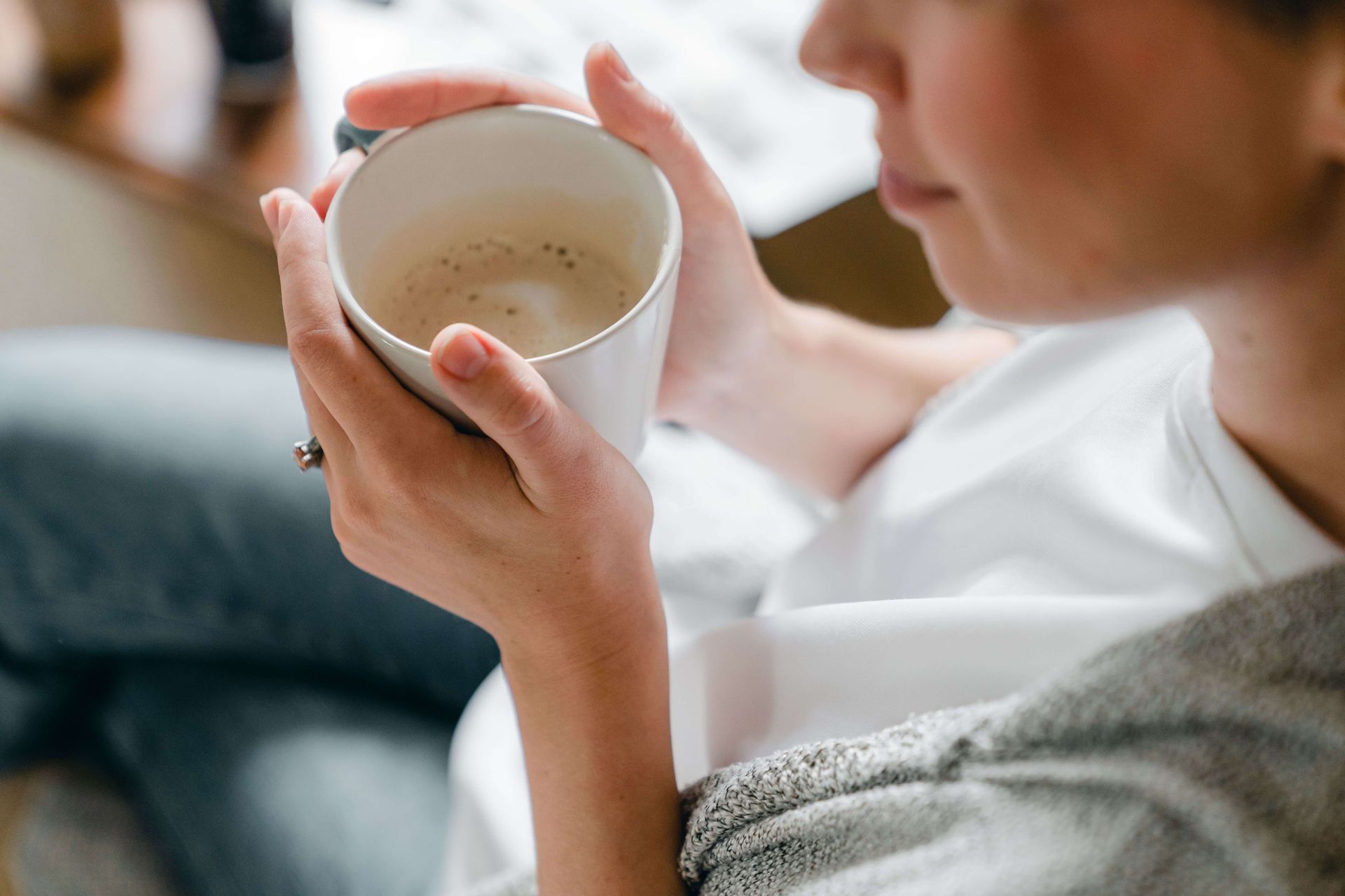 Close-up of a person peacefully drinking coffee from a mug, symbolizing healing, emotional regulation, and renewed balance through therapy for anxiety and grief in Omaha, NE | therapy for anxiety and grief omaha ne - therapy for grief and anxiety omaha ne - therapy for anxiety omaha ne - elkhorn - gretna - bennington - blair - millard - wahoo - waverly - papillion