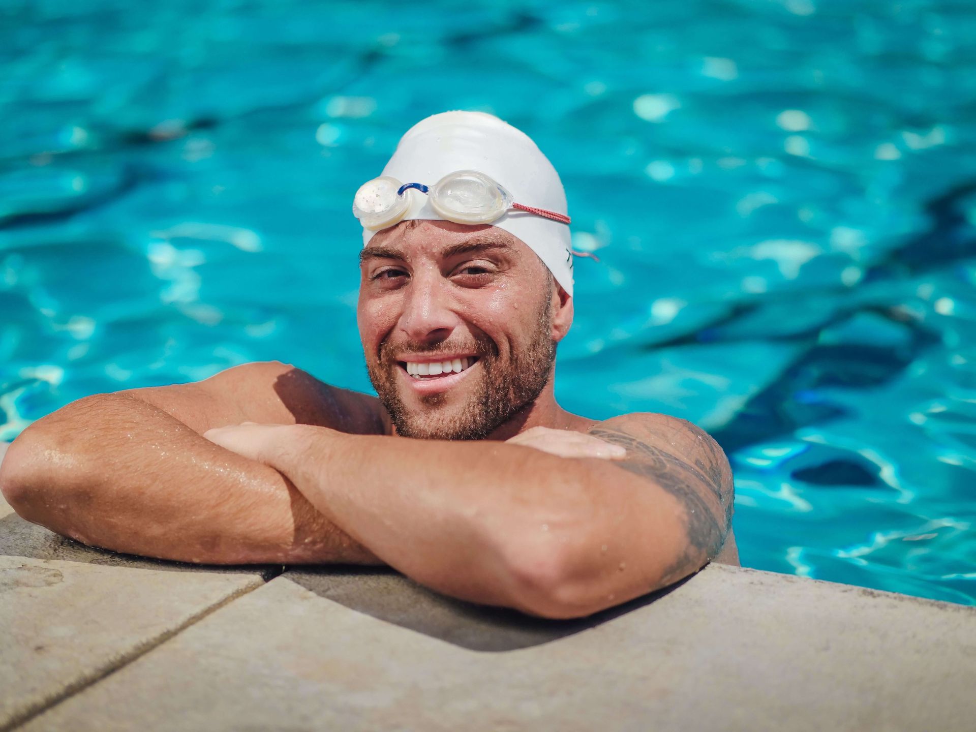 Happy athlete swimming, symbolizing confidence, resilience, and a healthier approach to athletic performance supported through sports anxiety therapy in Omaha, NE | online anxiety therapy omaha ne - anxiety therapy omaha ne - anxiety therapist omaha ne - elkhorn - gretna - bennington - blair - millard - wahoo - waverly - papillion