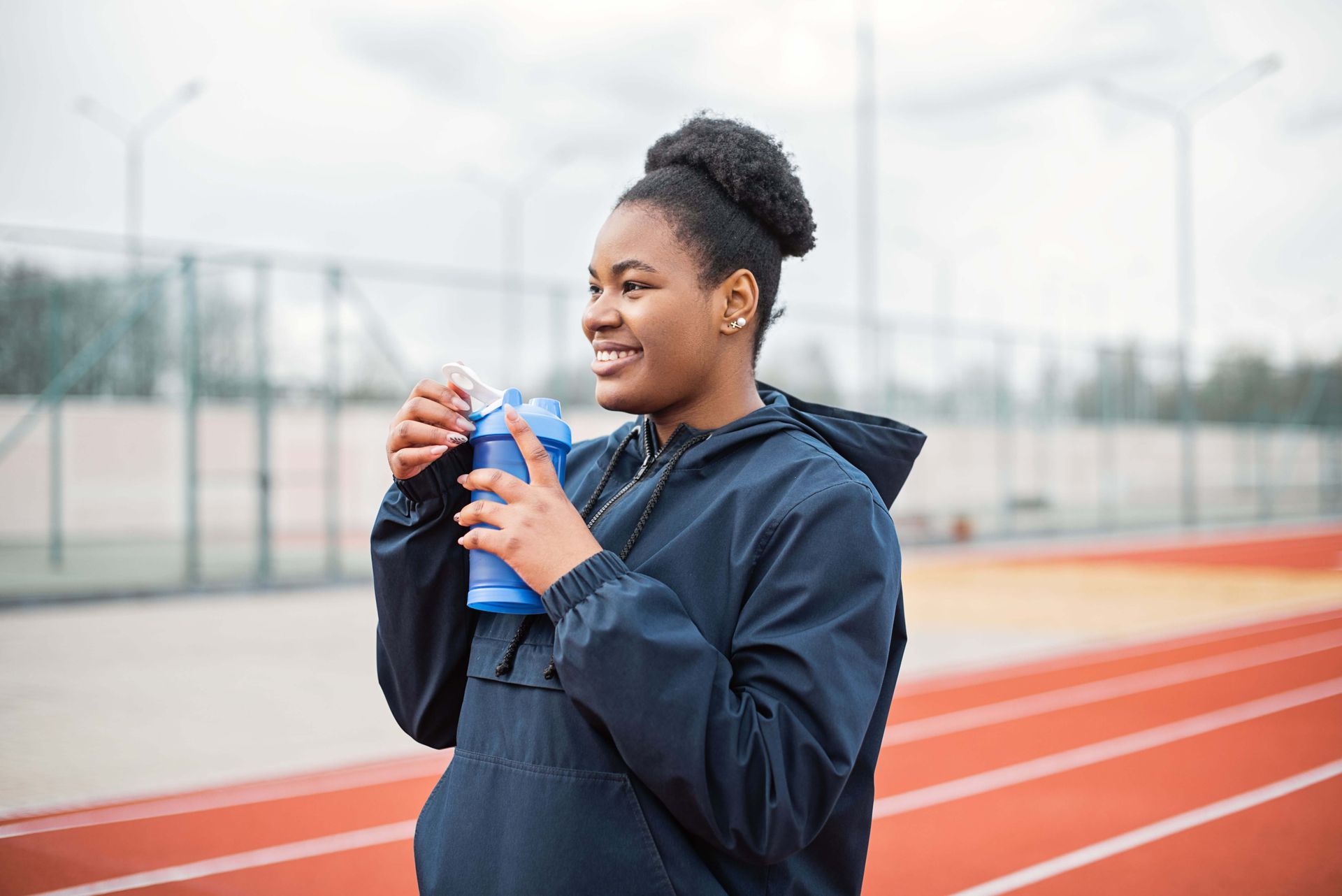 Smiling woman, symbolizing restored confidence, resilience, and positive progress supported through anxiety therapy in Omaha, NE | anxiety therapy omaha ne - sports performance anxiety omaha ne - anxiety therapist omaha ne - elkhorn - gretna - bennington - blair - millard - wahoo - waverly - papillion