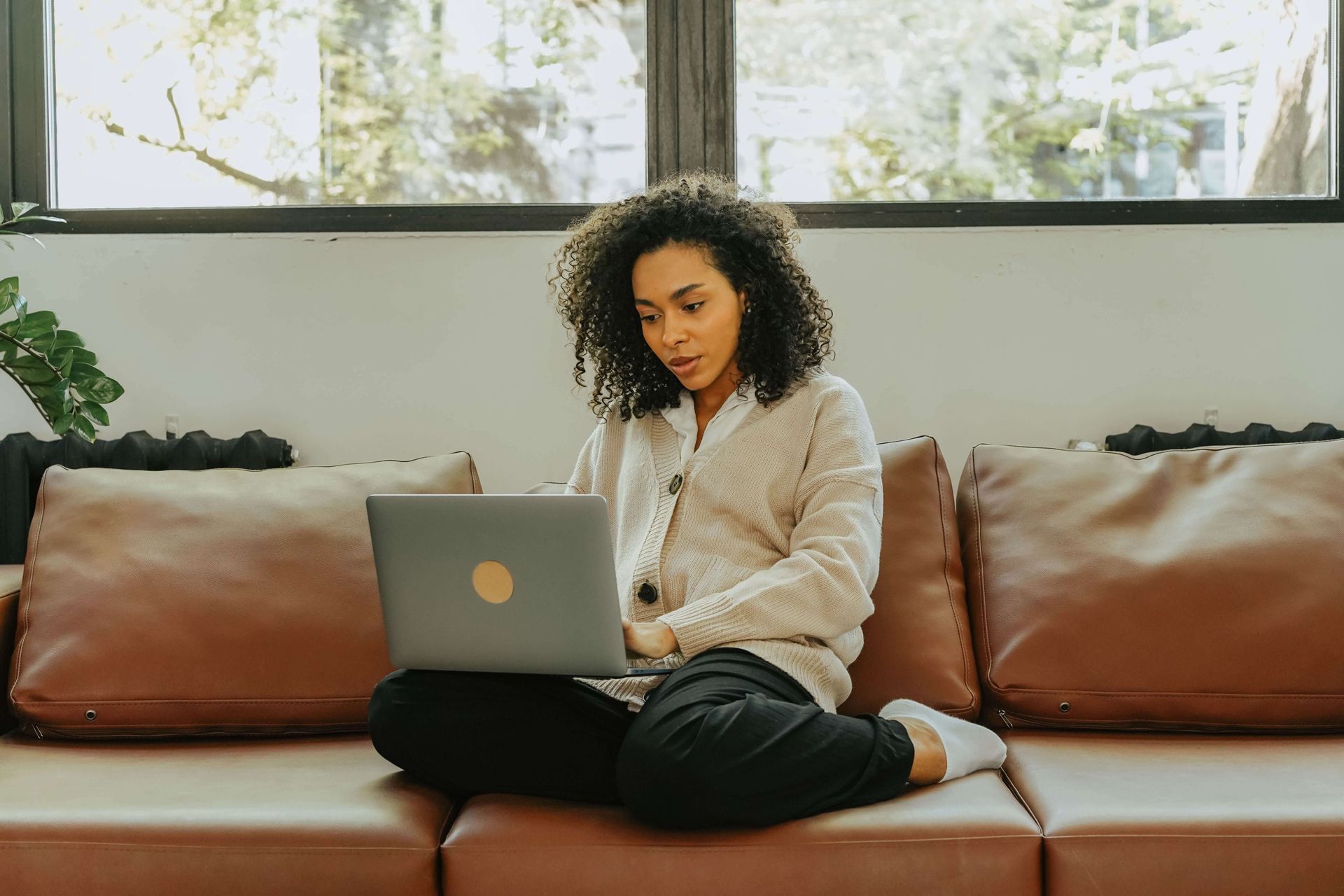 Person using a laptop, illustrating how online anxiety therapy provides flexible mental health support from home in Omaha, NE | online anxiety therapy omaha ne - anxiety therapy omaha ne - anxiety therapist omaha ne - elkhorn - gretna - bennington - blair - millard - wahoo - waverly - papillion