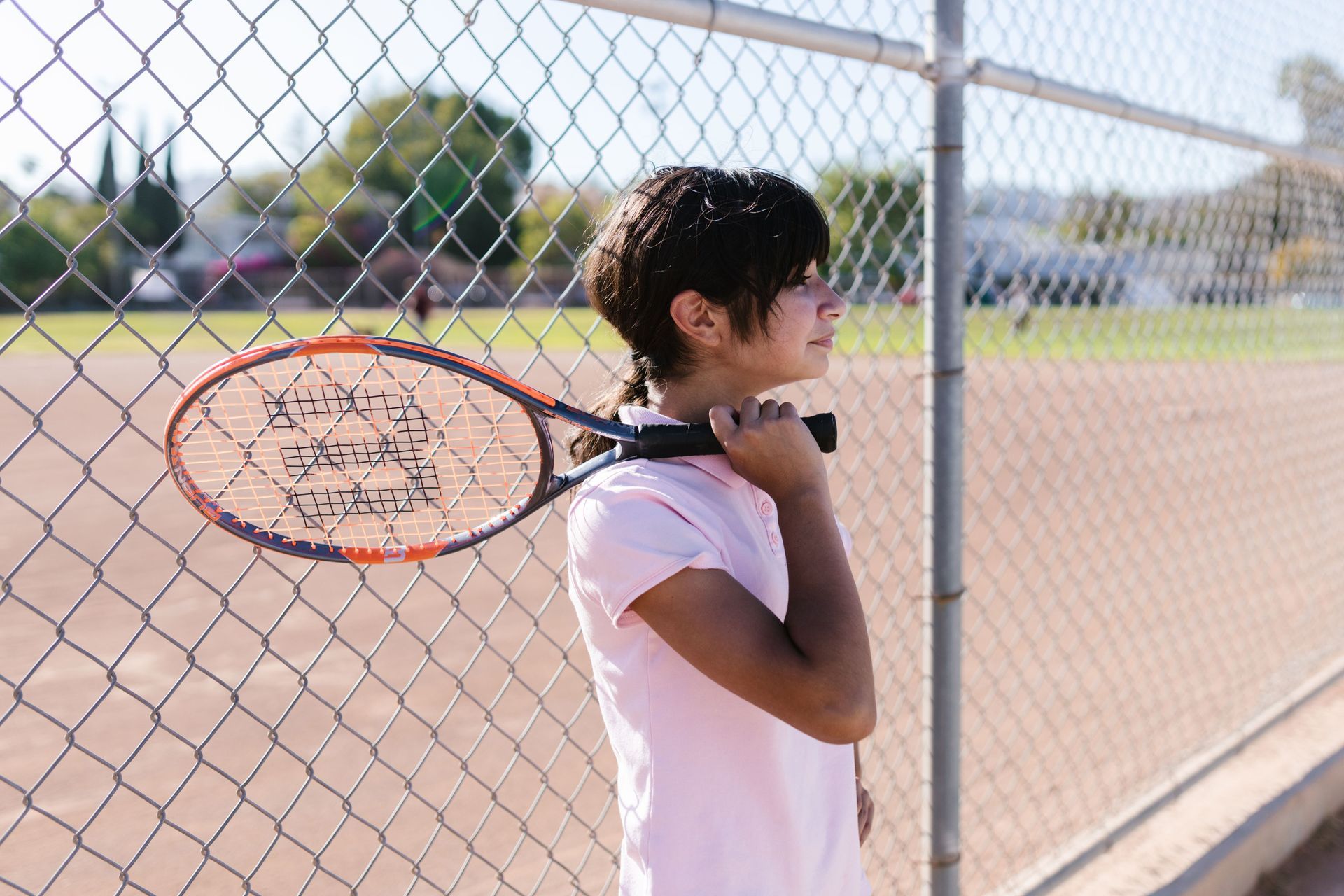 Happy young athlete smiling, representing renewed confidence and a positive mindset supported through anxiety in sports in Omaha, NE | anxiety in sports omaha ne - anxiety and athletes omaha ne - anxiety therapy omaha ne - elkhorn - gretna - bennington - blair - millard - wahoo - waverly - papillion
