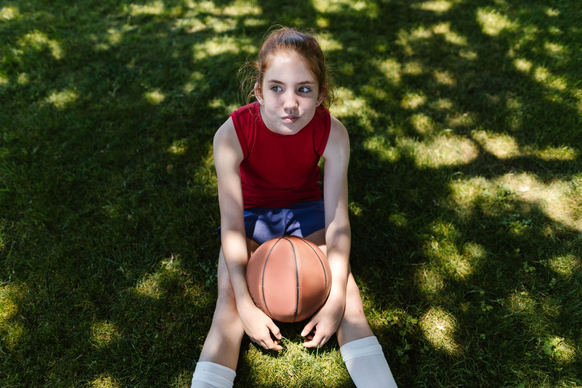 Stressed young athlete facing performance pressure. Anxiety therapy in Omaha, NE, can help.