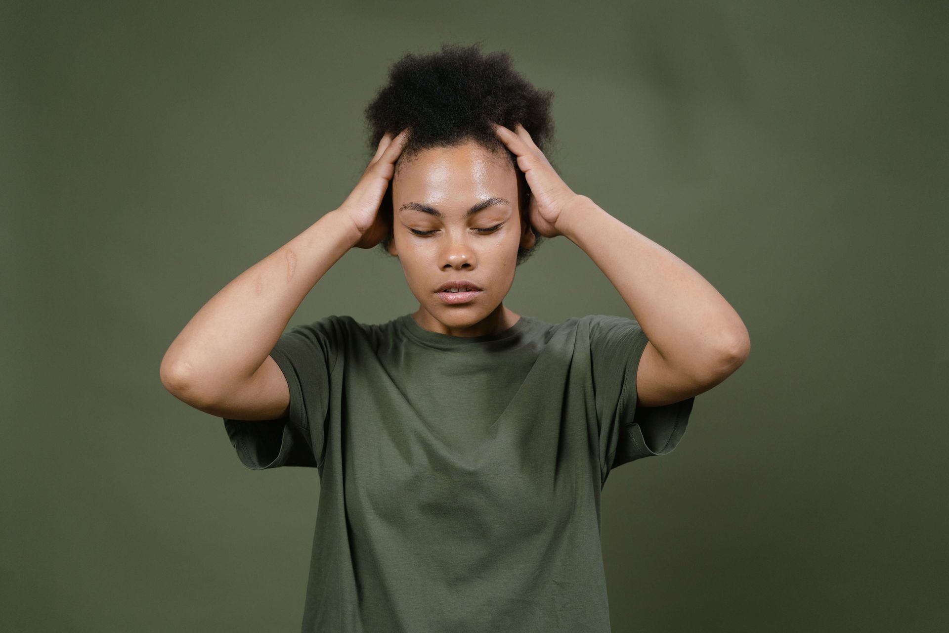 Woman appearing deep in thought and visibly stressed, illustrating anxiety symptoms explored in anxiety therapy in Omaha, NE | anxiety therapy omaha ne - anxiety and adhd therapy omaha ne - anxiety therapist omaha ne - elkhorn - gretna - bennington - blair - millard - wahoo - waverly - papillion