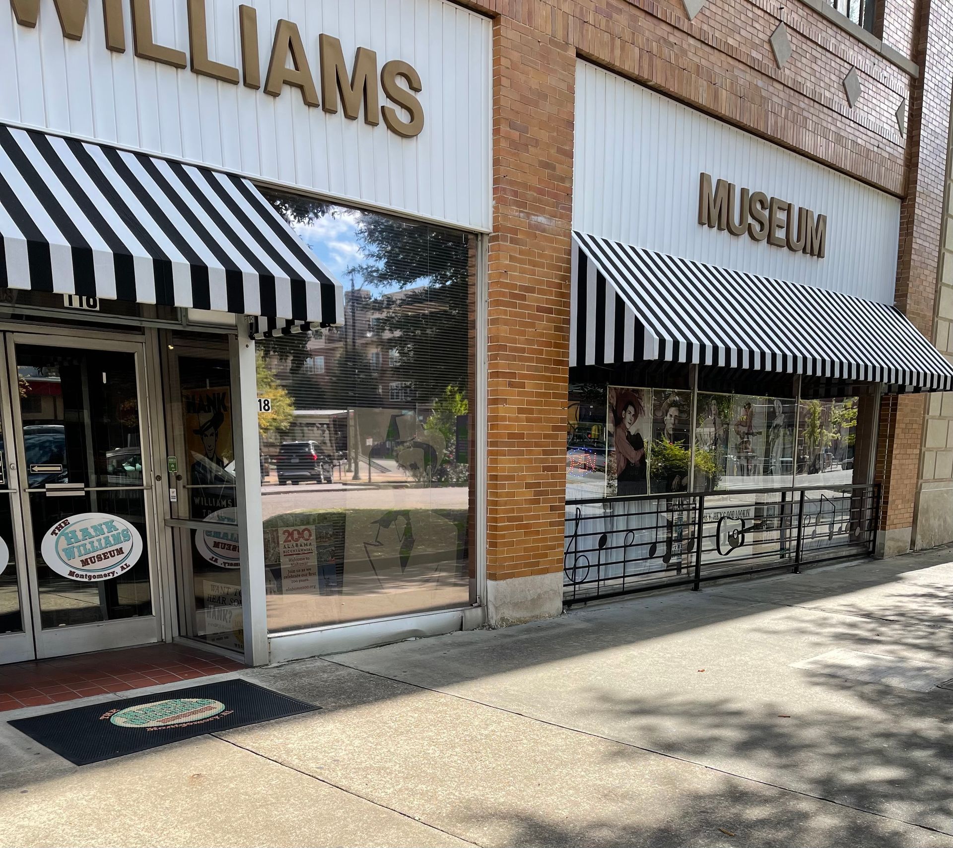 A store front with a striped awning that says williams museum