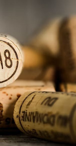 A bunch of wine corks are stacked on top of each other on a table.