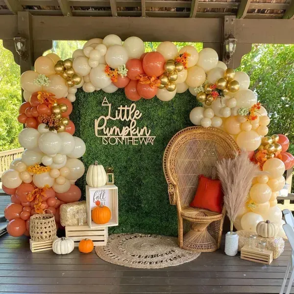 A little pumpkin is on the way baby shower with balloons and pumpkins
