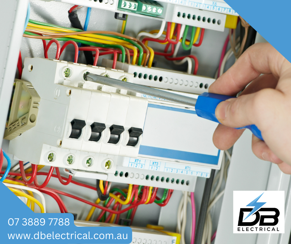 A Person Is Working On An Electrical Box With A Screwdriver – Brendale, QLD - DB Electrical