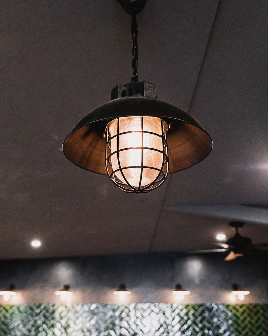 A Light Hanging From The Ceiling In A Dark Room – Brendale, QLD - DB Electrical