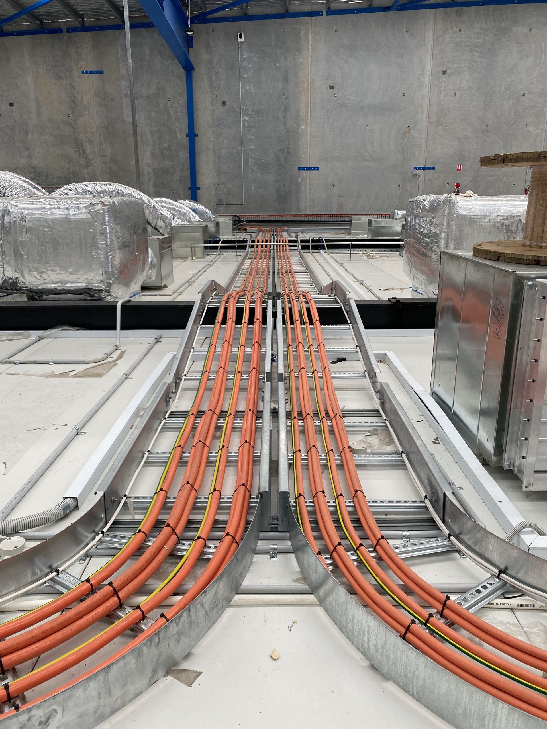 A Bunch Of Wires Are Connected To Each Other In A Warehouse – Brendale, QLD - DB Electrical