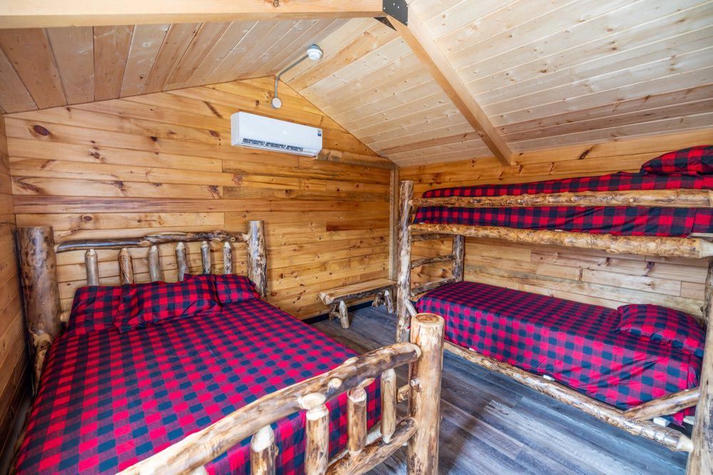 A Cabin With Blue Bedsheet In Kansas City