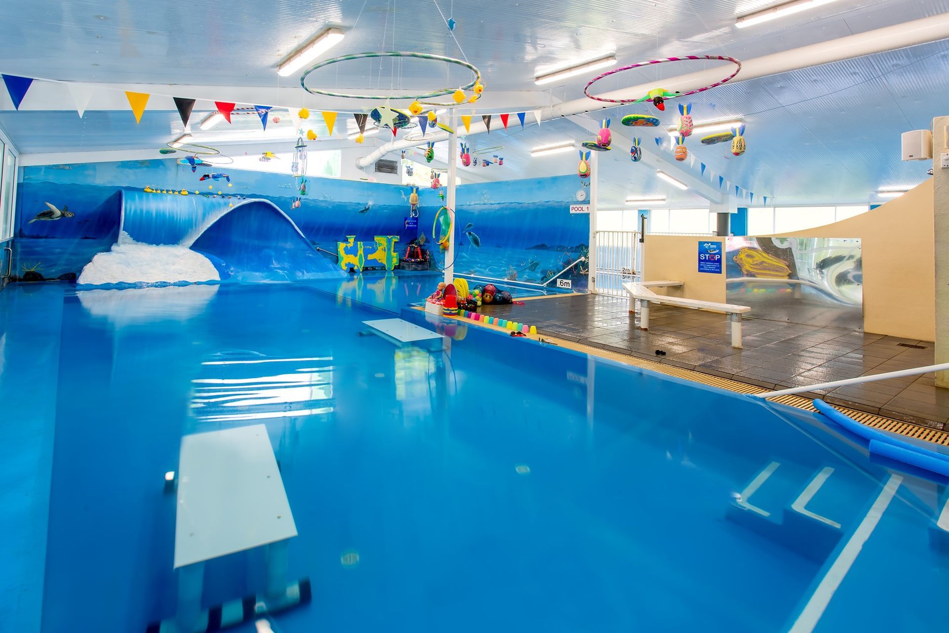 A large swimming pool area surrounded by toys — Swim Care Boambee in Coffs Harbour, NSW